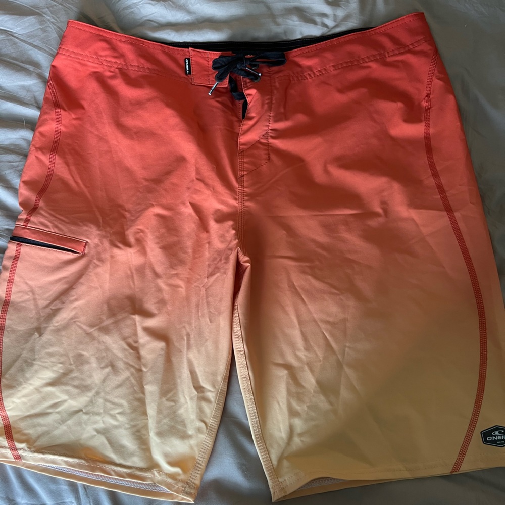O’Neill orange/yellow swim trunks. Men’s size 36
